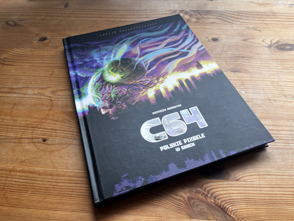 Hardback limited edition copy, the cover cover shows a flying head with a city in the background, made in pixel graphics